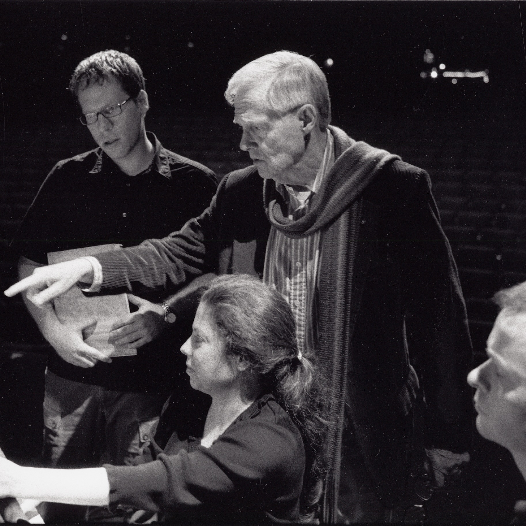 Ned Rorem pointing at something in rehearsal.