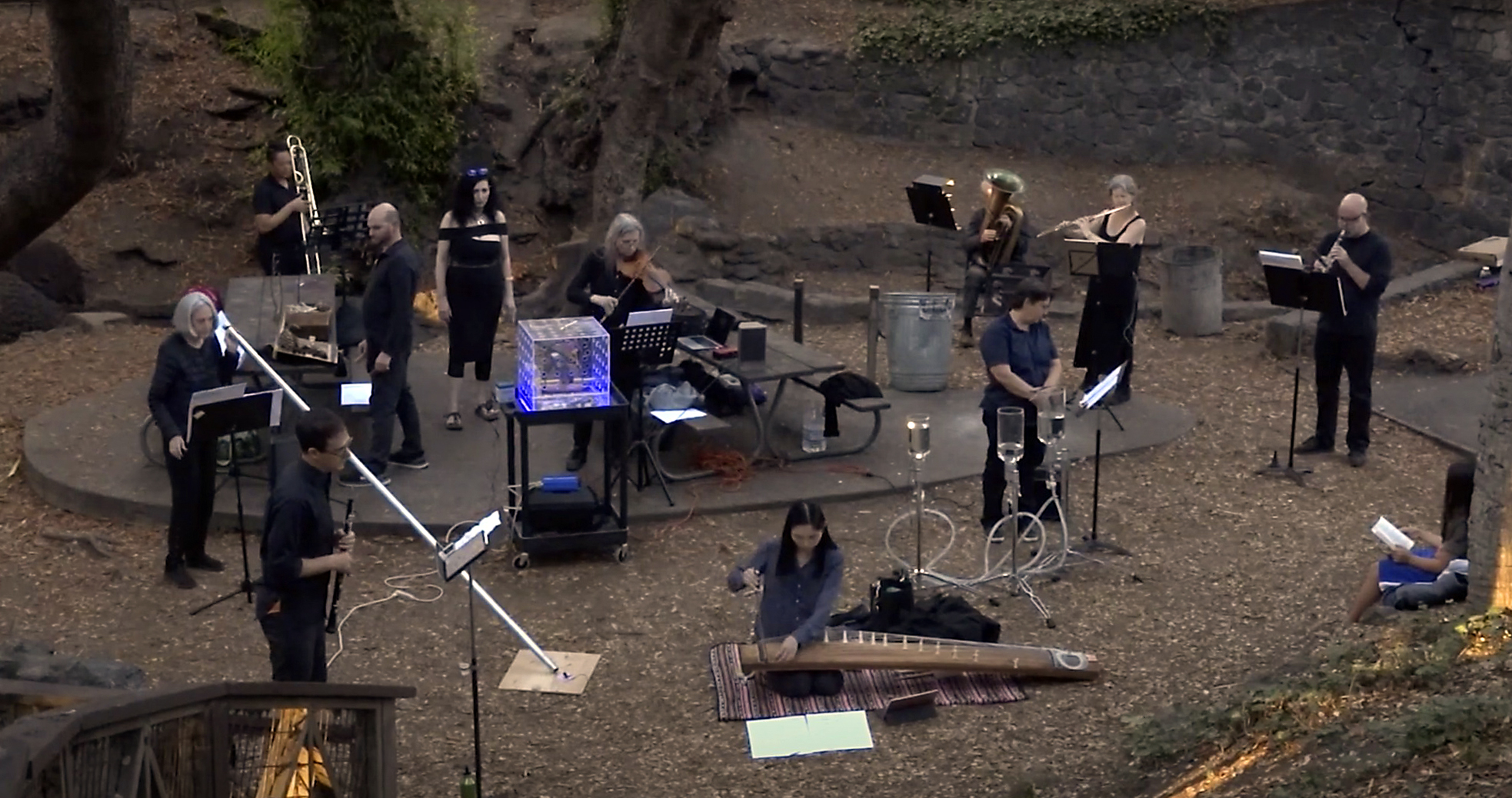 Large ensemble performing outdoors.