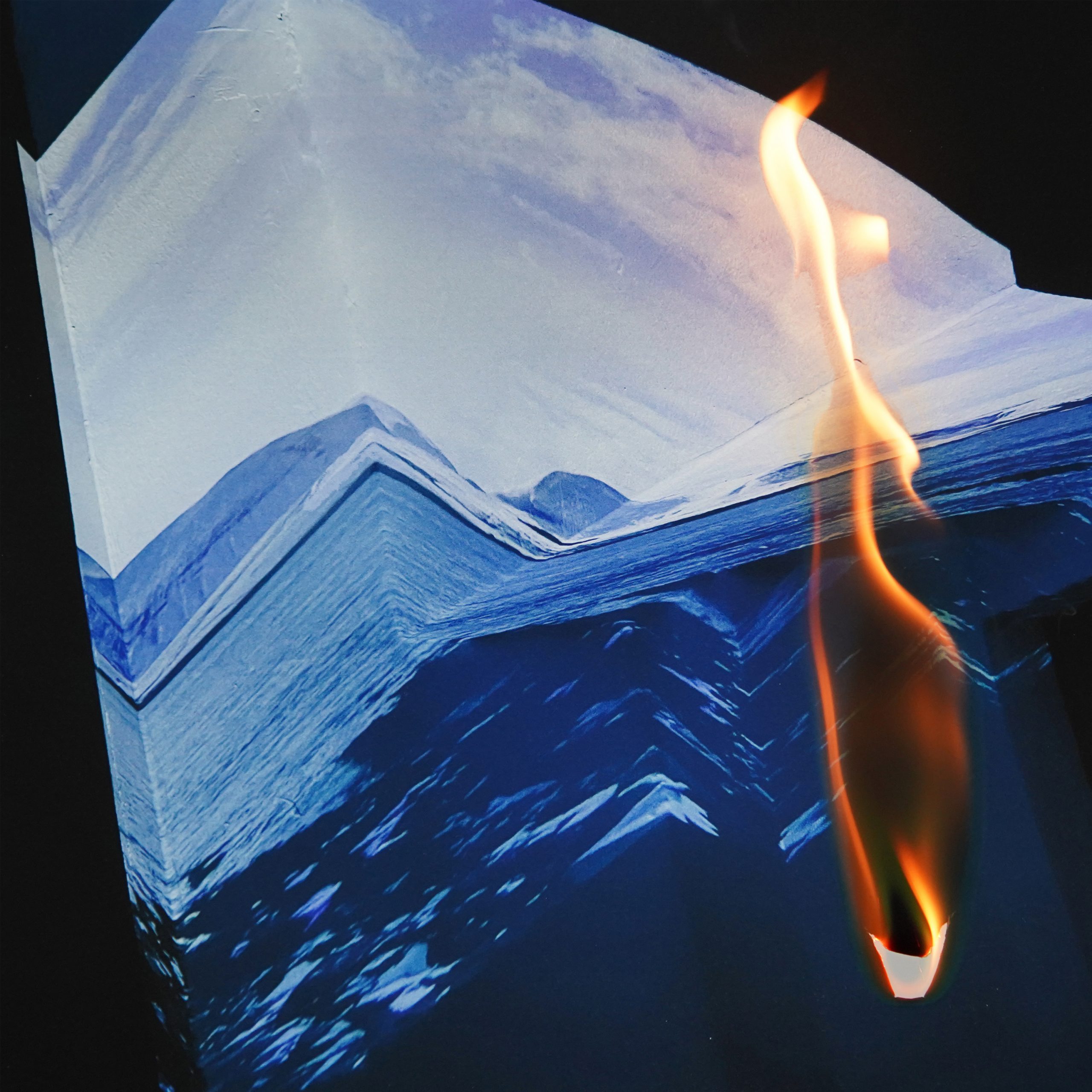 A folded image of an iceberg on fire.