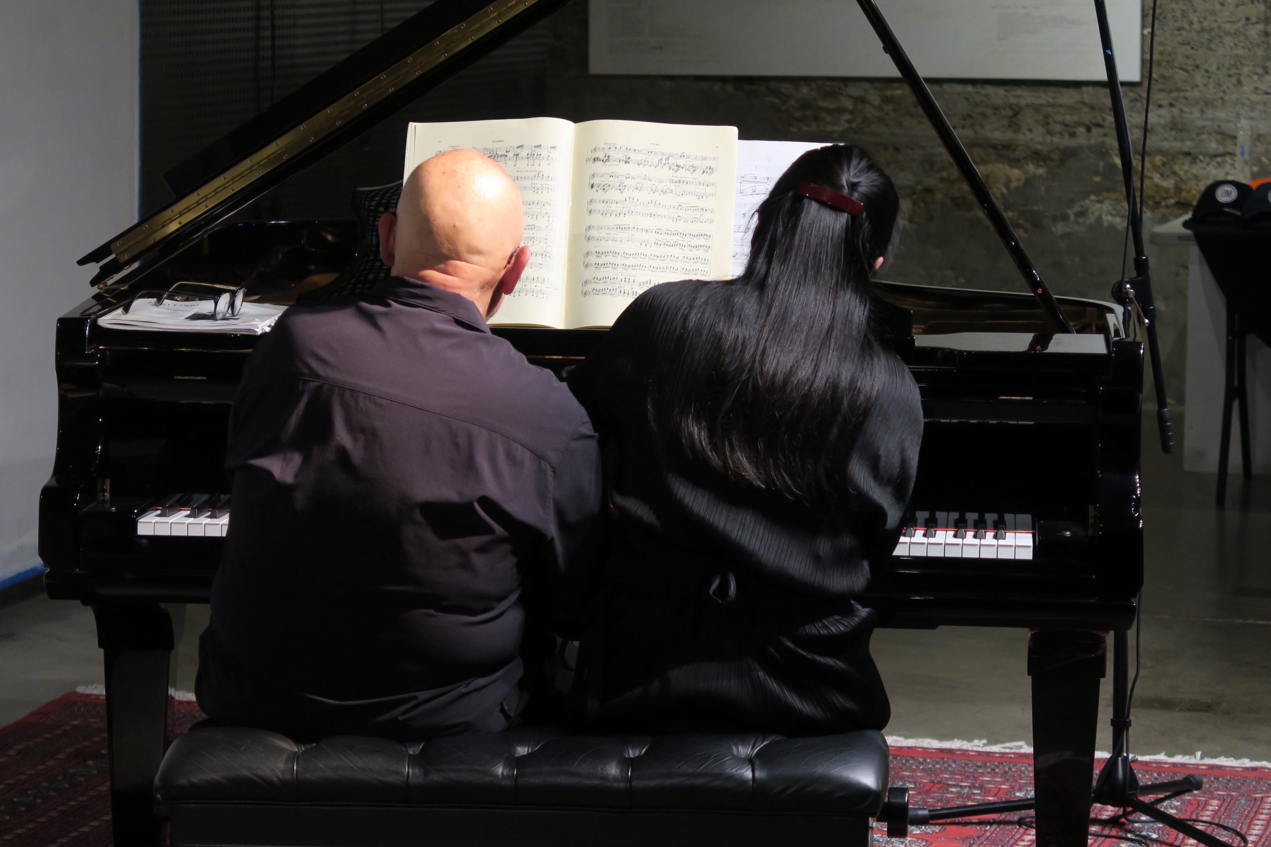 Dennis Russell Davies and Maki Namekawa playing piano