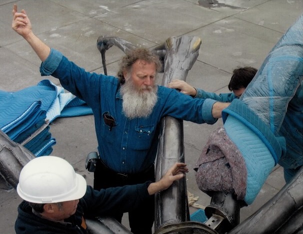 Scott Atthowe installing Louise Bourgeois sculpture “Crouching Spider" on the Embarcadero, San Francisco.