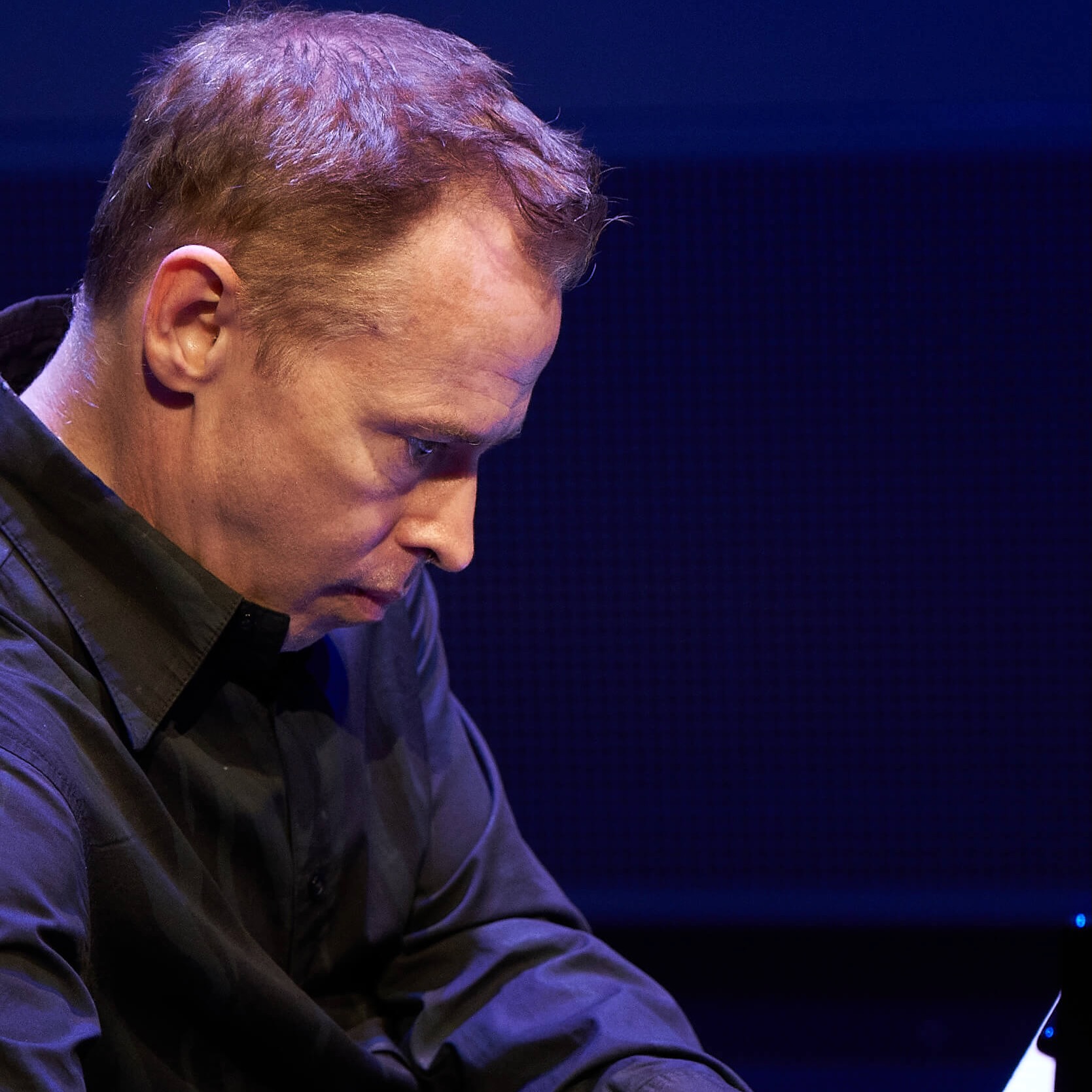 Close up shot of Geoffrey Burleson playing piano.
