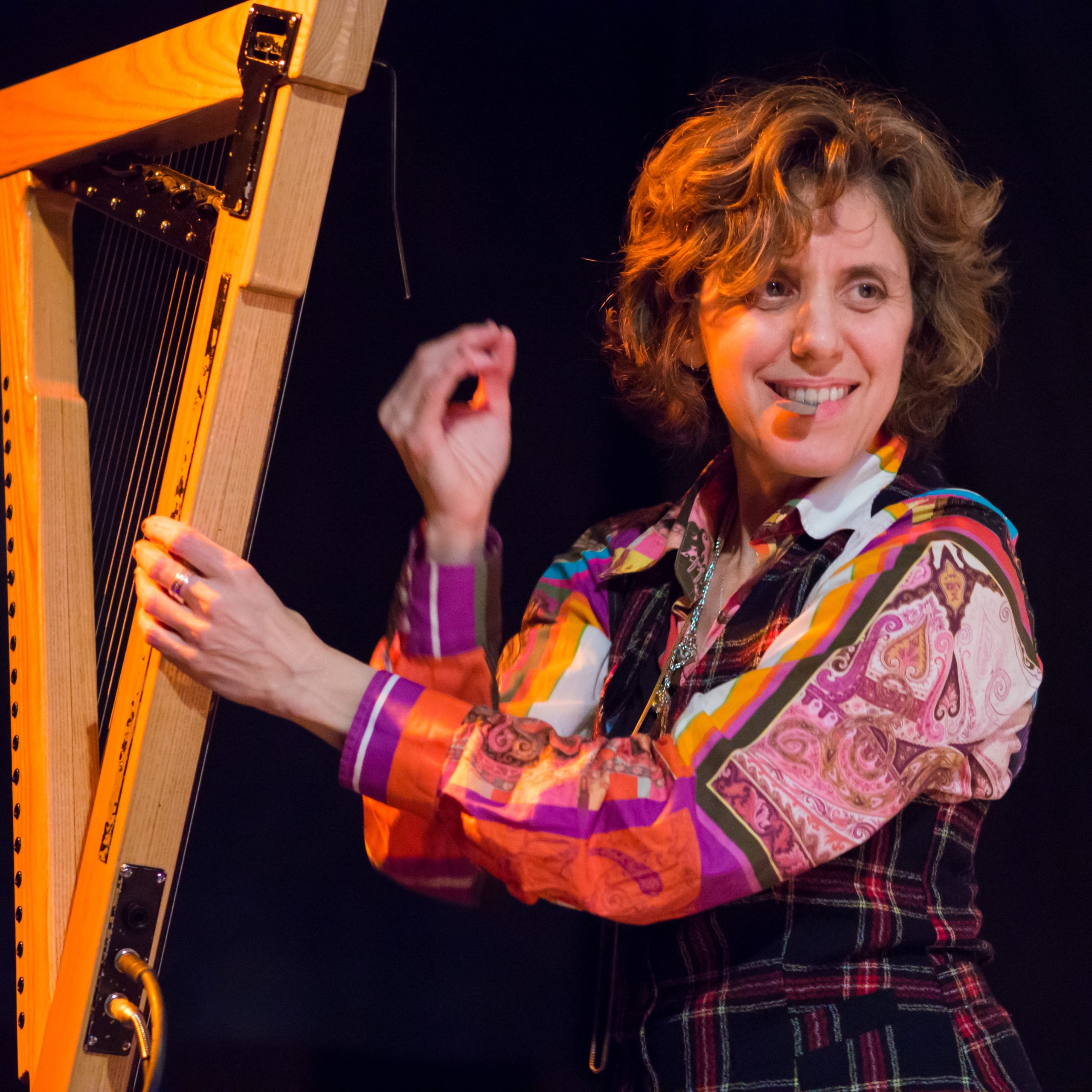 Zeena Parkins Zeena Parkins holding a harp.