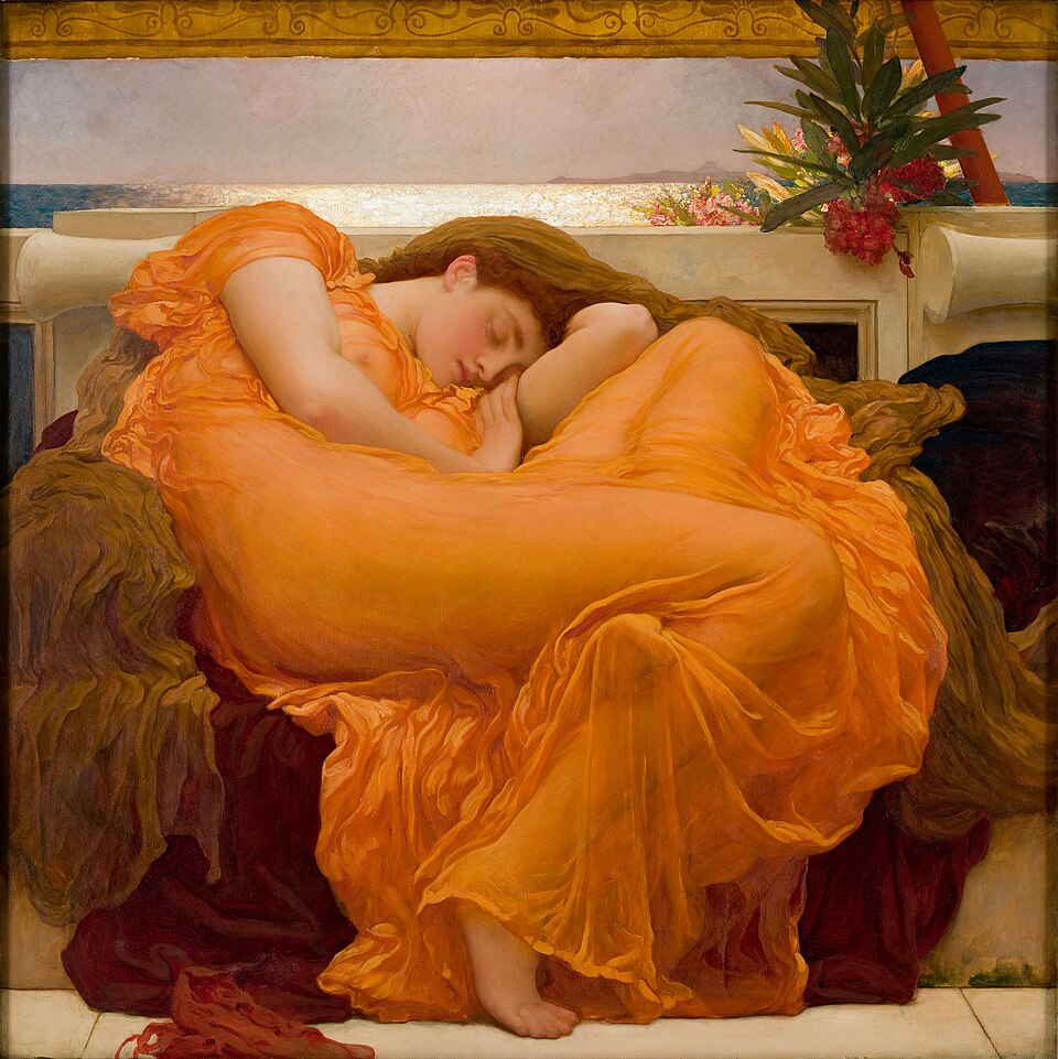 A woman in an orange dress sleeps in chair.