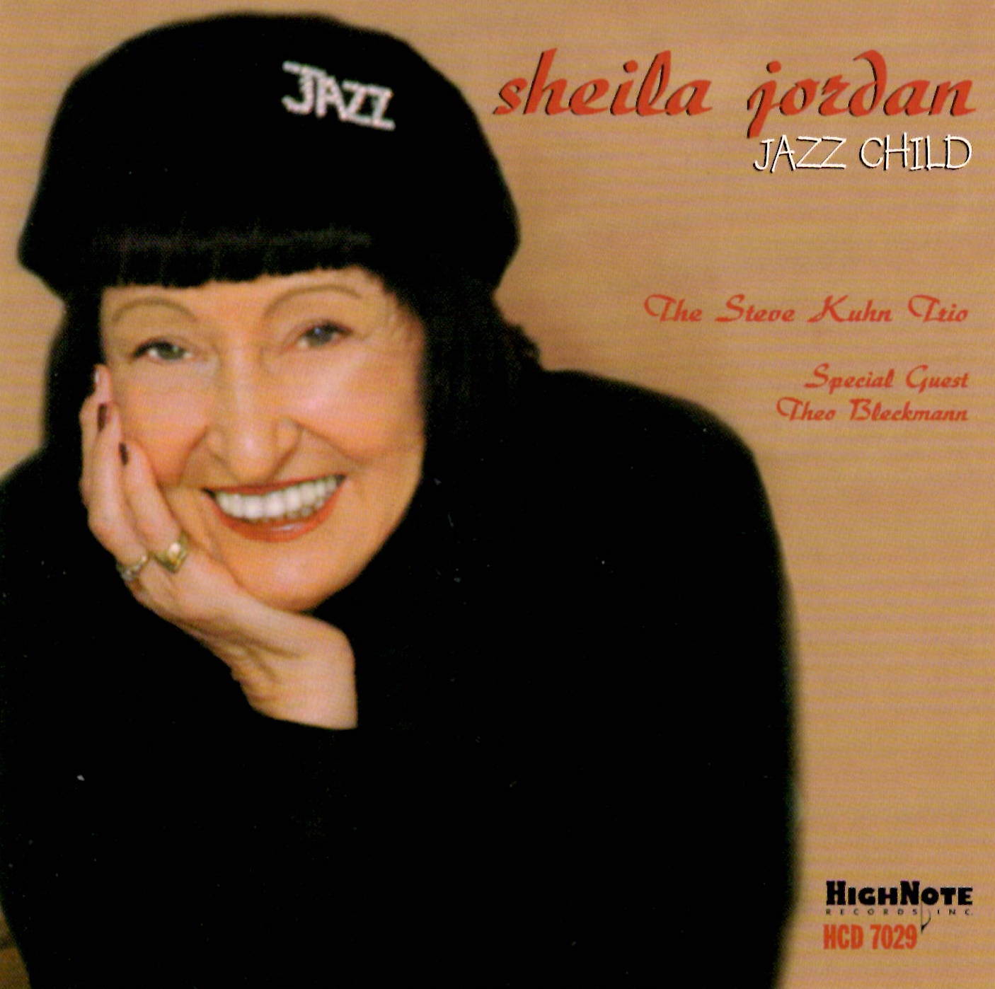 Sheila Jordan: Jazz Child An album cover of a smiling woman in a beret that has the word "jazz" on it. There is text to the right of her.