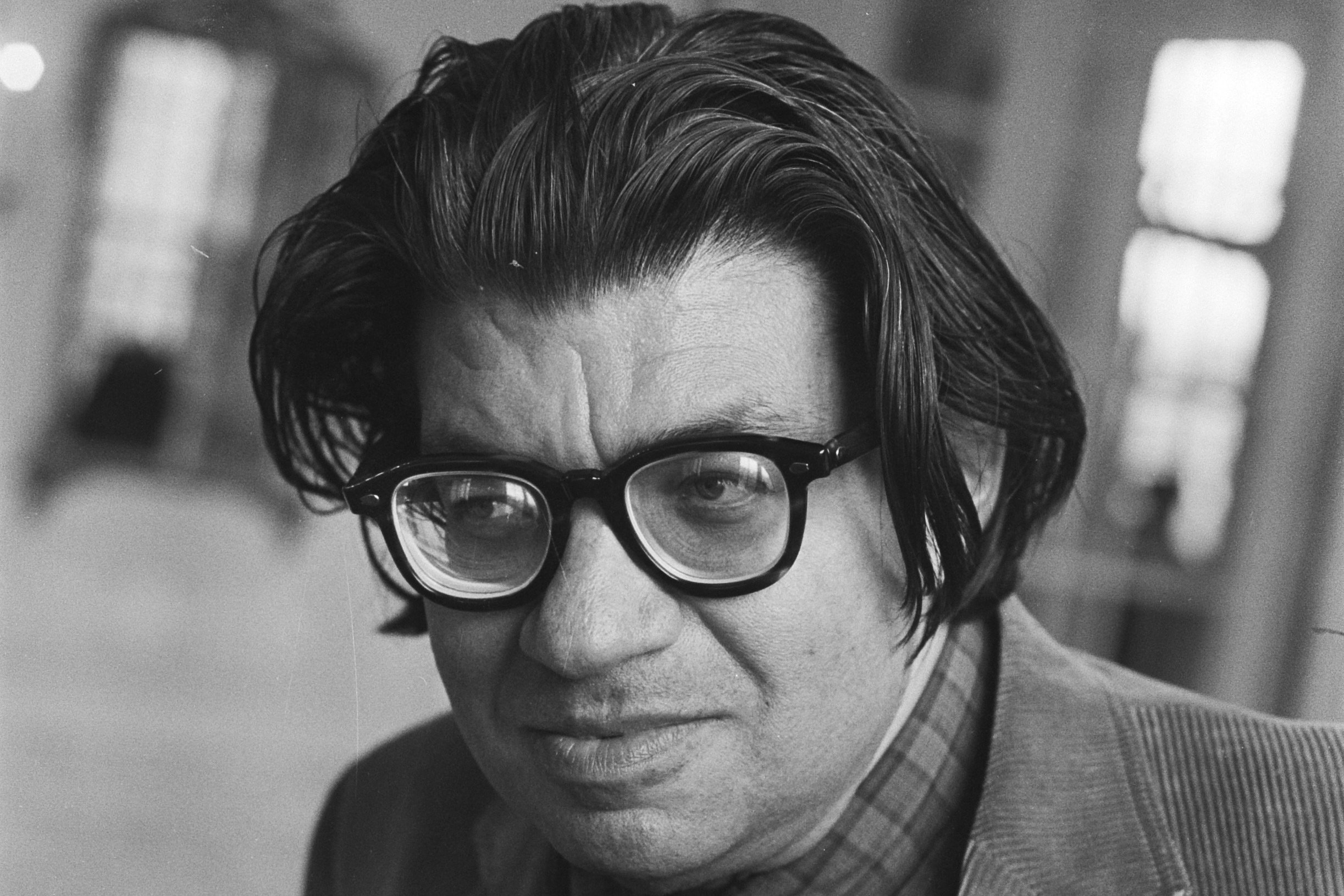 Morton Feldman wearing glasses with shoulder length hair