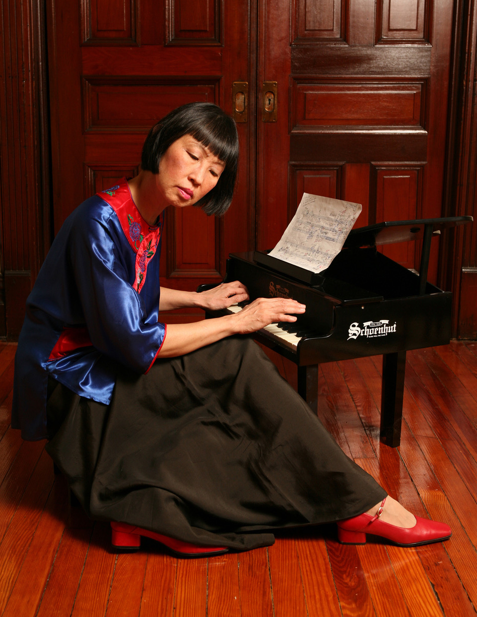 Margaret Leng Tan playing a toy piano.