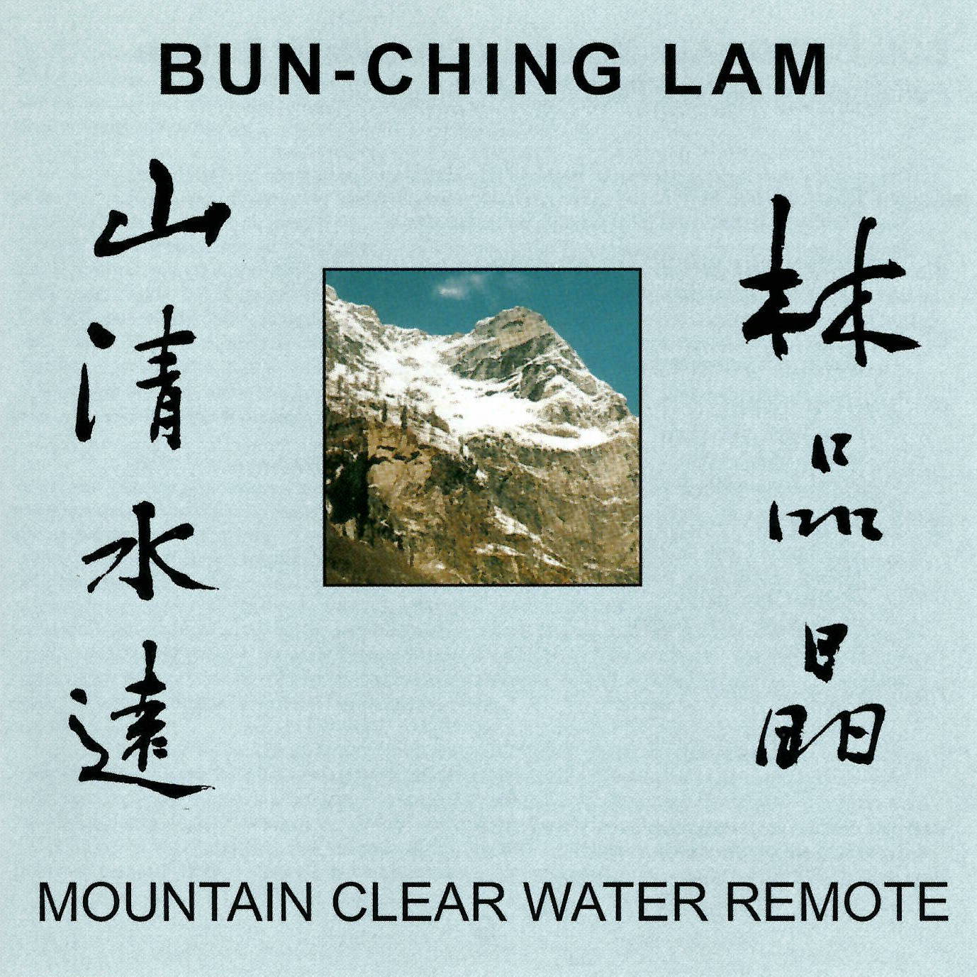 Black text in many languages frames a picture of a mountain.