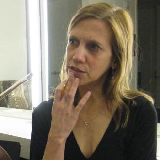cropped_1370_ca_object_representations_media_4540_large A woman looking to her right touching her chin with her hand.
