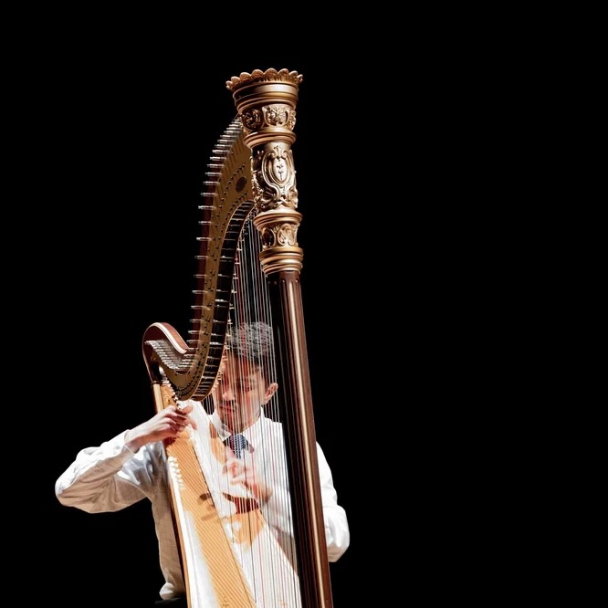 Juan Riveros playing harp