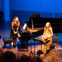 Sylvie Courvoisier and Mary Halvorson bowing after a performance.
