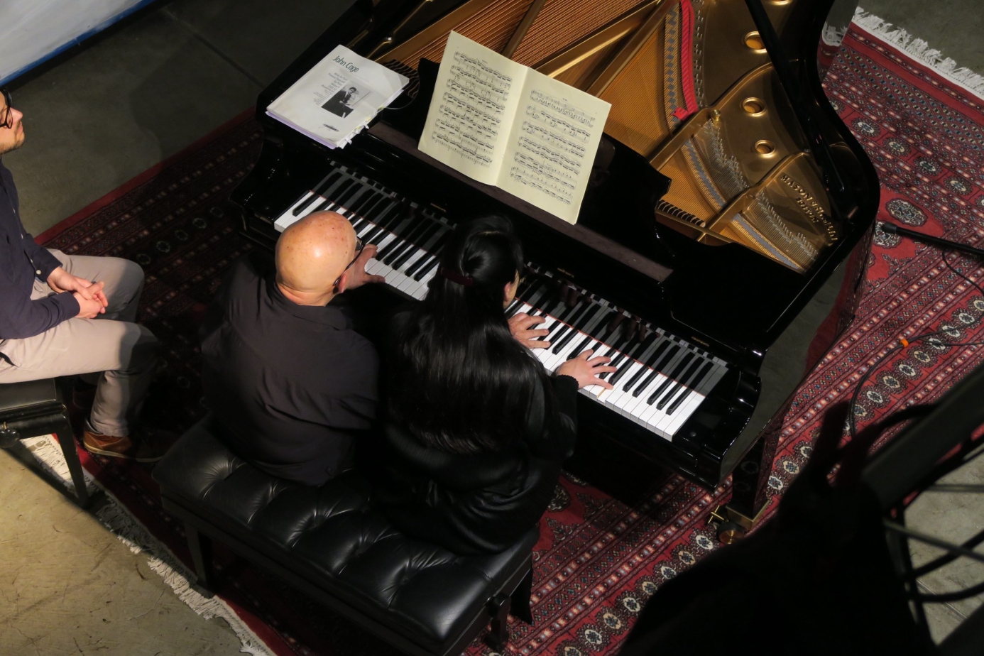 Maki Namekawa and Dennis Russell Davies playing piano
