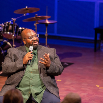 Darius Jones speaking during a panel discussion.