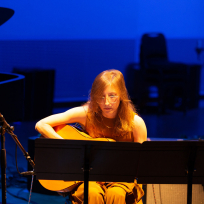 Mary Halvorson playing guitar.