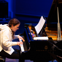 Sylvie Courvoisier playing piano.