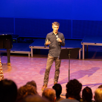 Blaine Todd speaking on stage.
