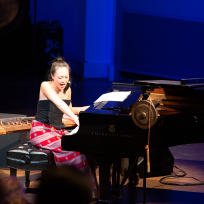 Jen Shyu playing piano.
