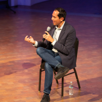 Nate Chinen speaking during a panel discussion.