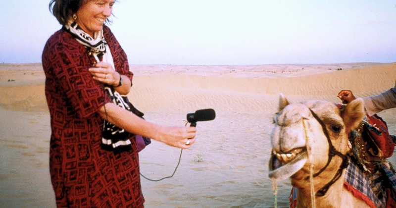 Hildegard Westerkamp recording a camel with a microphone